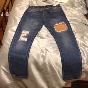 Jeans with rip and sequin designs